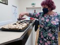 05/11/211. Sue  + her cakes at Fish & Chip Quiz night, .